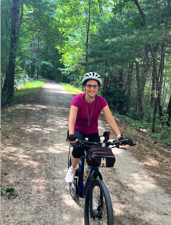 Miki riding her new electric bike